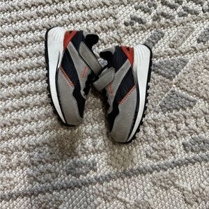 Stylish Black and Red Sneakers Reebok